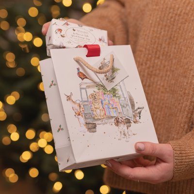 Small christmas gift bag driving home for christmas